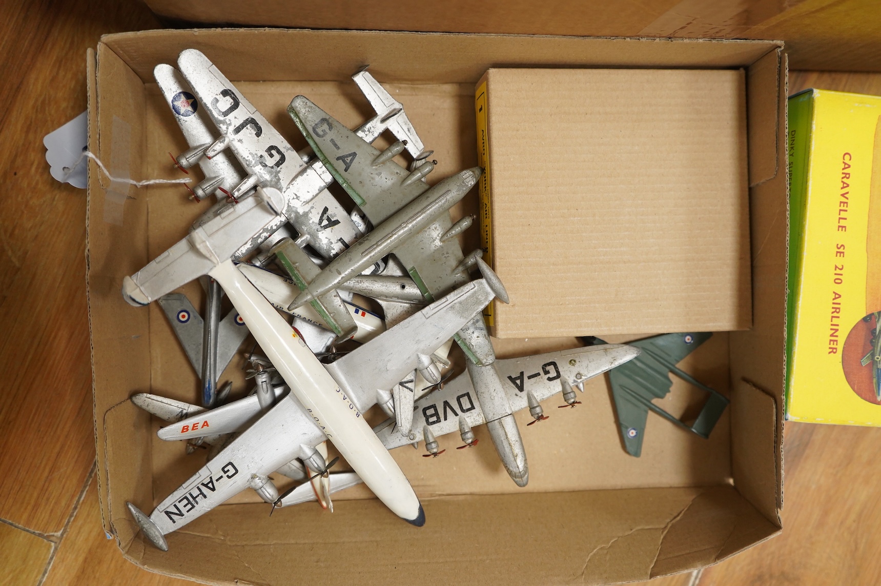 Twenty-three Dinky Toys and Supertoys, all playworn, restored, repainted or overpainted, (twelve in reproduction boxes), twelve aircraft, five Foden, 8-wheel commercial vehicles, a tank transporter with Centurion tank, a